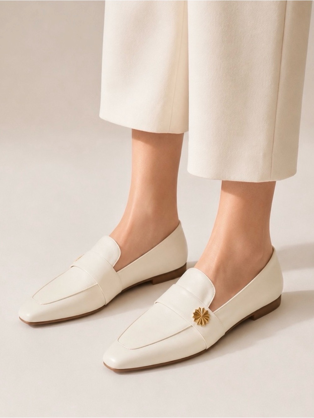 Stuart Weitzman Off White Leather Pointed Loafers with Gold Accent